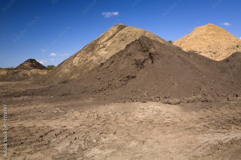 Mounds of sand in a commercial sandpit, Quebec, Canada, North America