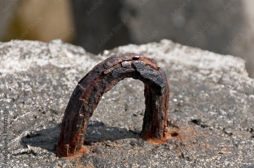Fototapeta premium Rusty mounting ring of a concrete block