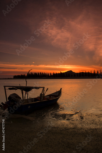 scenery of sunset at Lumut,Perak,Malaysia. Soft focus,motion blur due to long exposure.Visible Noise due to high ISO.