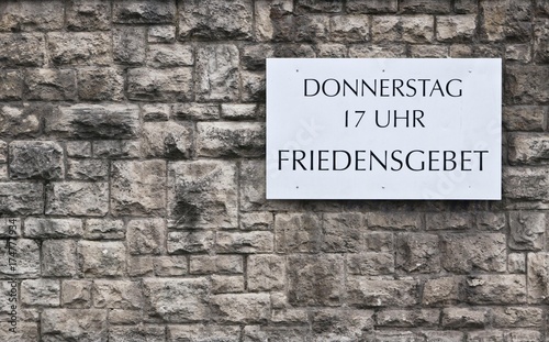 "Donnerstag 17 Uhr Friedensgebet" German for "Thursday, 5pm, prayer for peace", sign on a church wall, Erfurt, Thuringia, Germany, Europe