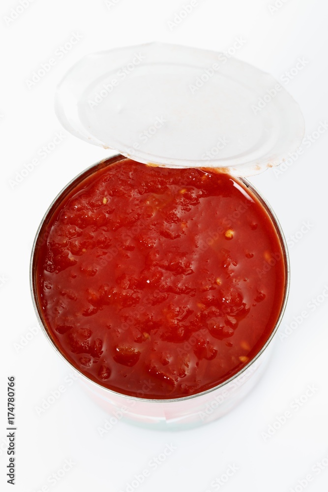 Opened tin of chopped tomatoes, from above Opened tin of chopped tomatoes, from above