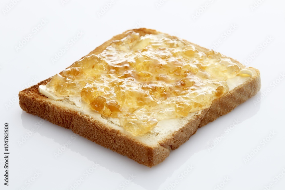 Slice of toast, toasted slice of bread, with ginger jam