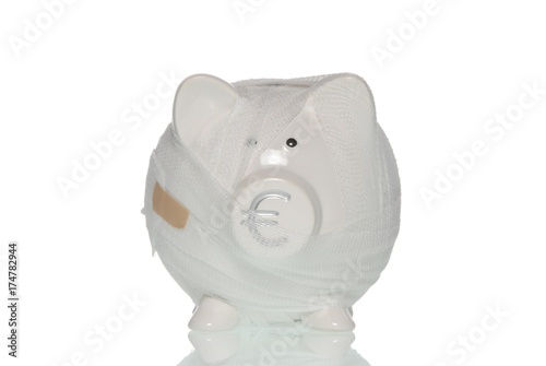 Bandaged piggy bank, symbolic image for the ailing Euro