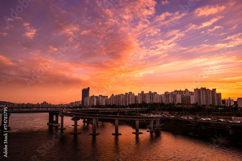 Sunset landscape between Hangang road and apartments where the intersection of Seoul and South Korea is visible.