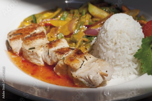 Grilled turkey skewer with wok vegetables and boiled rice