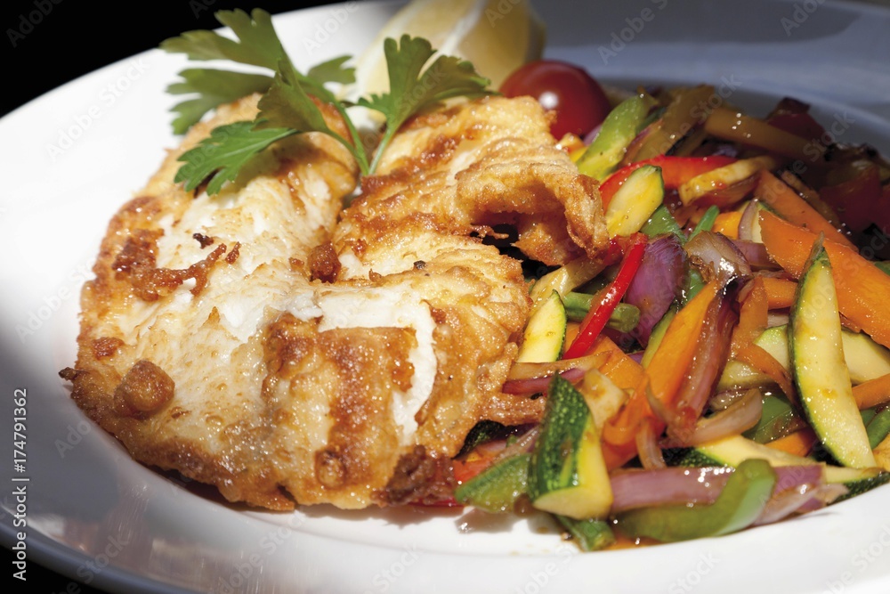 Wok vegetables with redfish fillet Wok vegetables with redfish fillet