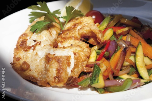 Wok vegetables with redfish fillet photo