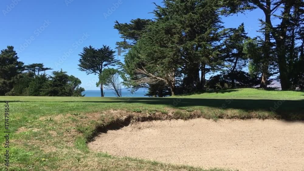 Sand trap near a golf course hole Sand trap near a golf course hole