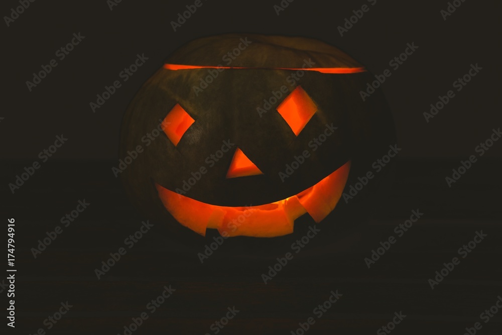 Jack o lantern glowing in darkroom Jack o lantern glowing in darkroom