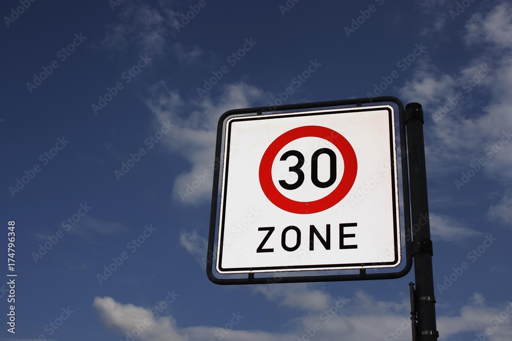 Traffic sign 30-zone it with blue sky and clouds Traffic sign 30-zone it with blue sky and clouds