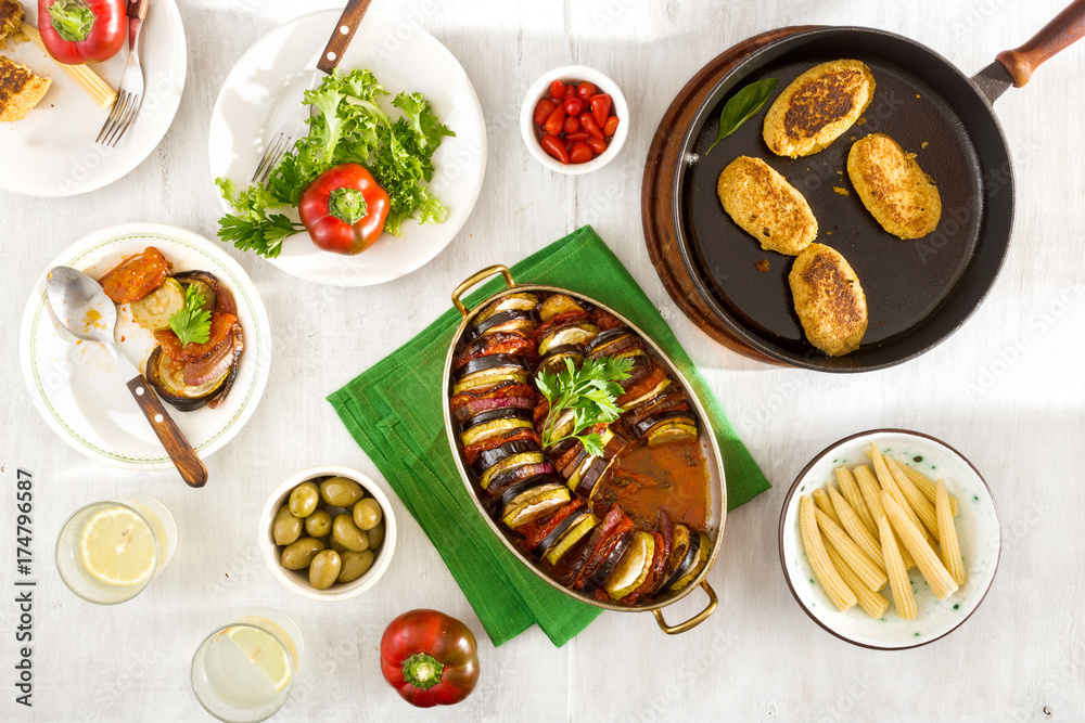 Ratatouille, chickpeas cutlets, lemonade and various snacks, top view Ratatouille, chickpeas cutlets, lemonade and various snacks, top view