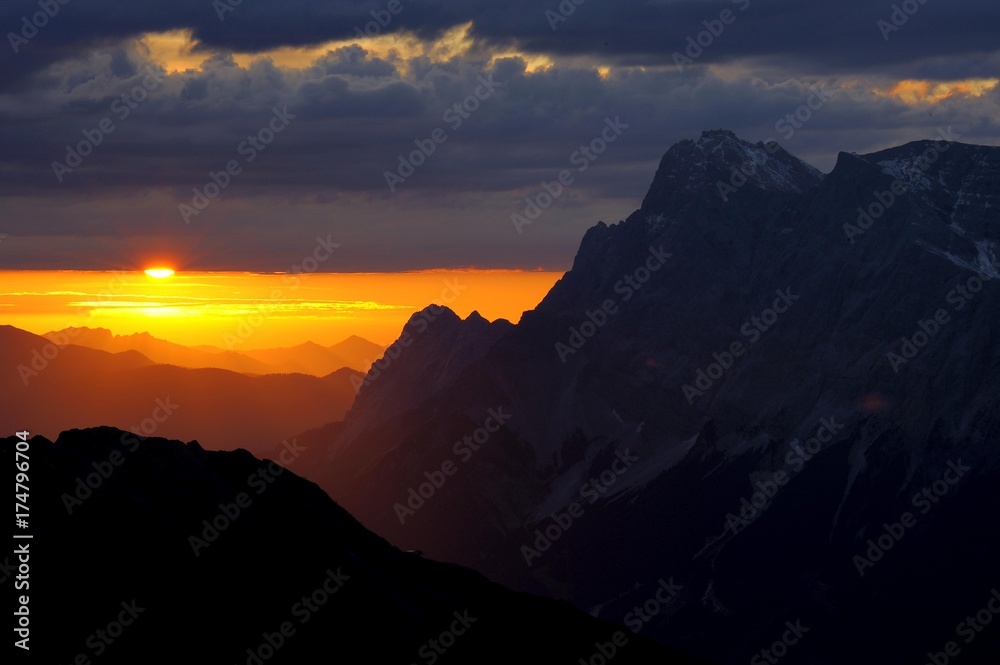 Sunrise behind Zugspitze Mountain with staggered mountain peaks, Berwang, Ausserfern, Tyrol, Austria, Europe