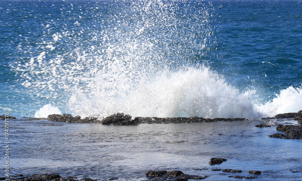 Waves hitting rocks Waves hitting rocks