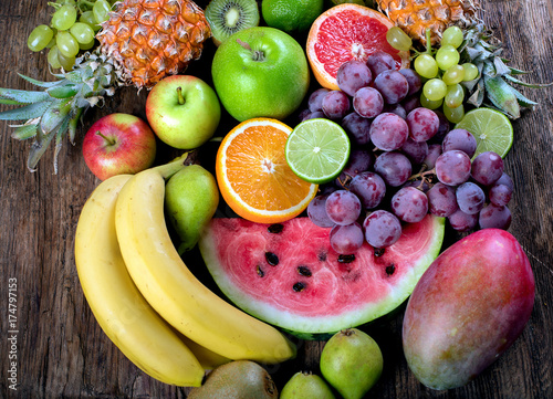 Fototapeta Naklejka Na Ścianę i Meble -  Fresh organic fruits background. Healthy eating concept. Top view.