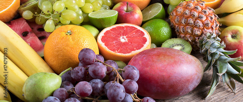 Fresh fruits background. Healthy eating concept. Panorama.