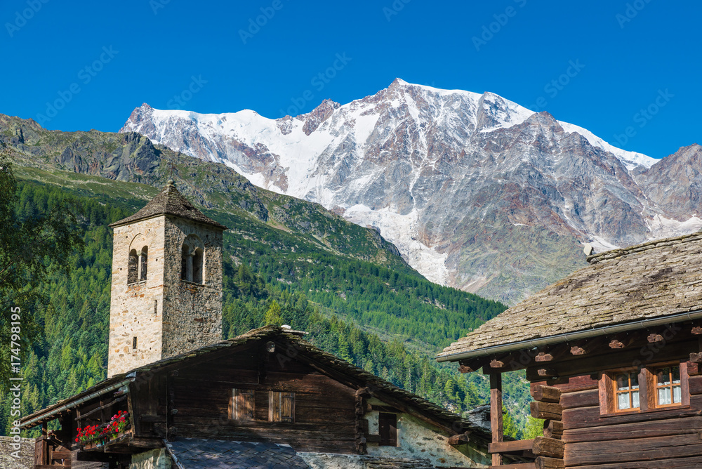 Mountain landscape. The Alps with Monte Rosa and the spectacular east wall of rock and ice from the picturesque alpine village of Macugnaga (Staffa), Italy