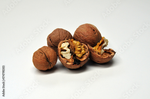 Tapety artystyczne Brown Walnuts on the White Background
