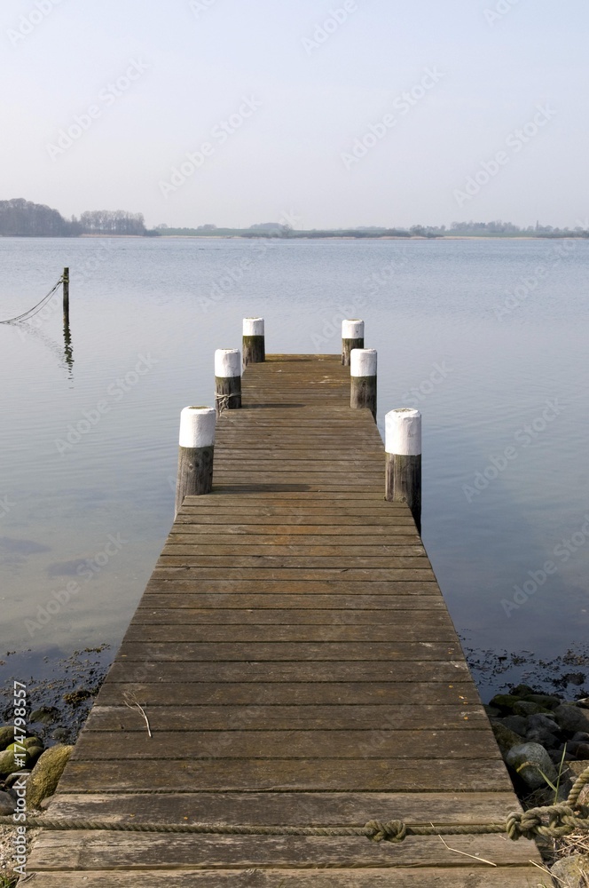 Obraz premium Jetty in the Maasholm fishing village, Schlei river, Schleswig-Holstein, Germany, Europe