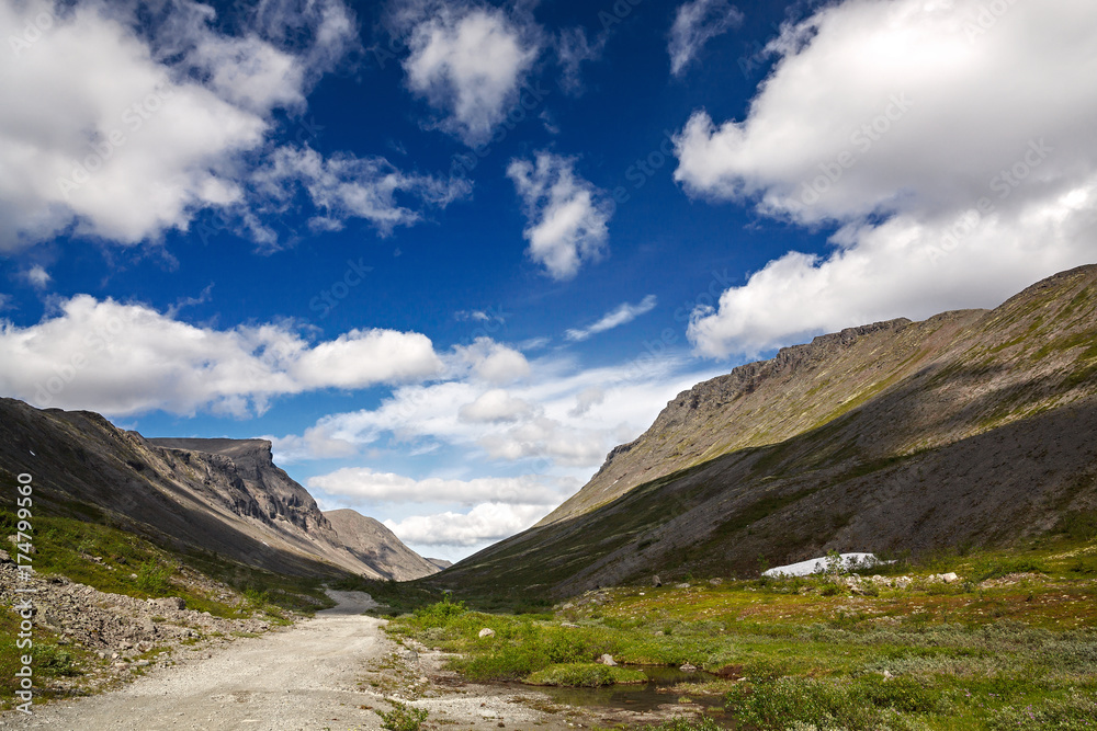 Road in the mountains of Khibiny, Kola Peninsula, Russia. Road in the mountains of Khibiny, Kola Peninsula, Russia.