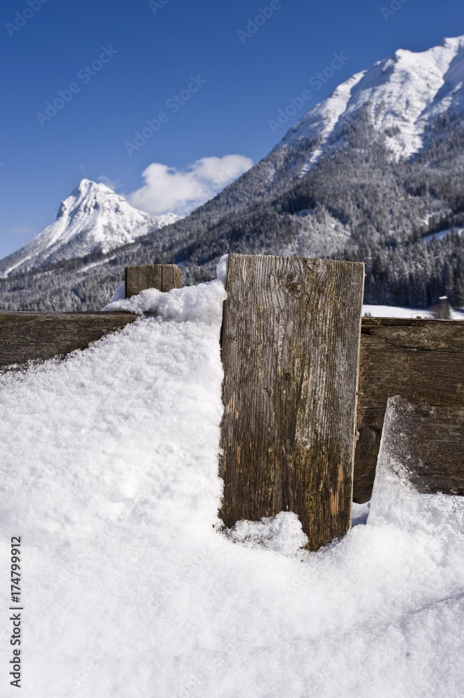 Snow-covered fence in front of Mt Guffert, alps, Tyrol, Austria, Europe