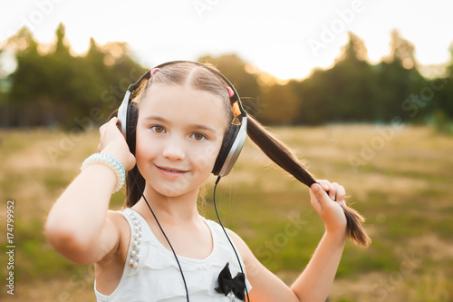 beautiful girl with long hair listening song
