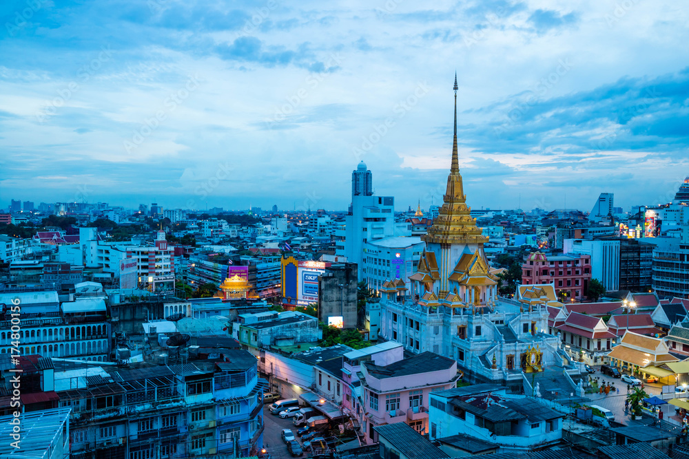 Fototapeta premium Bangkok cityscape skyline, Thailand. Modern tower and local building, temple at twilight evening