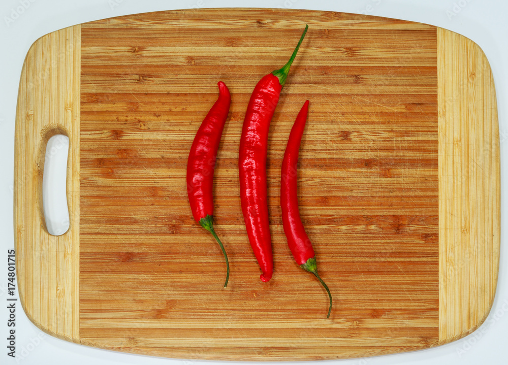 Red fresh chili pepper on wood desk Red fresh chili pepper on wood desk