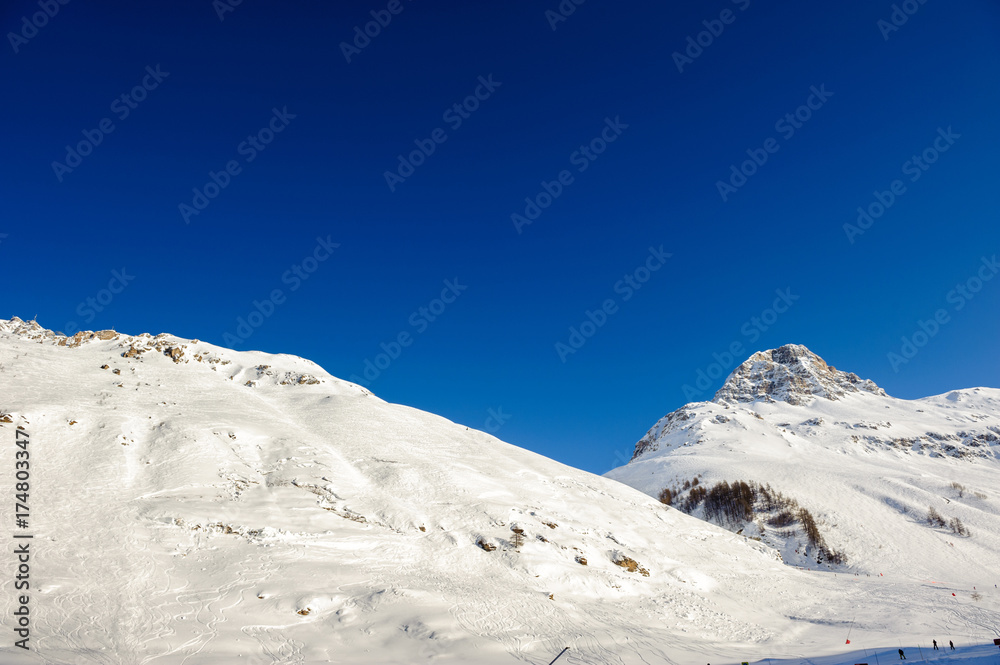 Alpine winter mountain landscape. French Alps with snow.