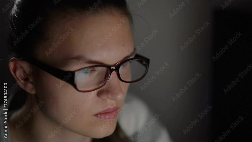 Young woman using notebook computer at night, Beautiful female student studying at night Young woman using notebook computer at night, Beautiful female student studying at night