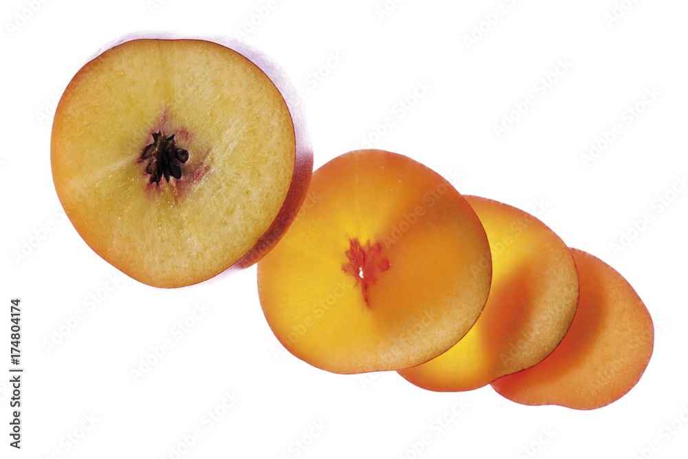 Half a nectarine and slices of nectarine Half a nectarine and slices of nectarine