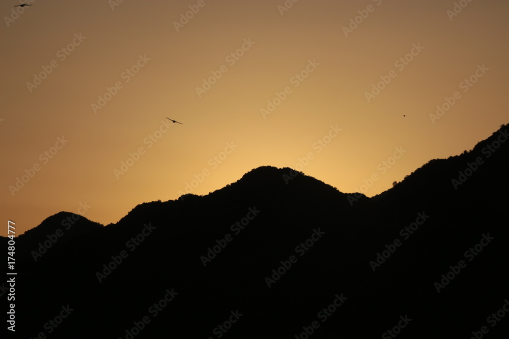 The black mountains of Montenegro in sunset light. Montenegro means: black mountain. Seen from Virpazar, Lake Skadar, in direction to the sea. Southeast Europe.