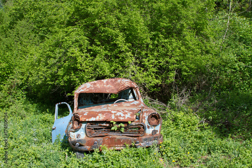 old rusty car at garden