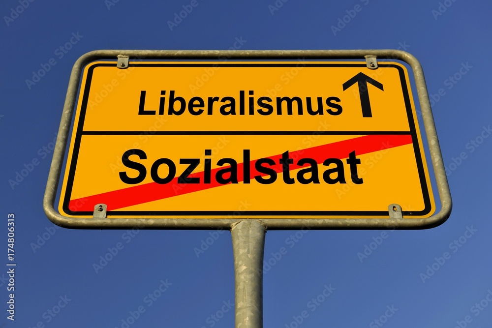 City limits sign with the words Liberalismus and Sozialstaat, German for liberalism and the welfare state, symbolic image for the end of the welfare state and the beginning of liberalism City limits sign with the words Liberalismus and Sozialstaat, German for liberalism and the welfare state, symbolic image for the end of the welfare state and the beginning of liberalism