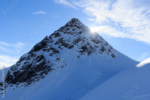 Mountain panorama with snow and sun in winter in Stubai Alps, Austria