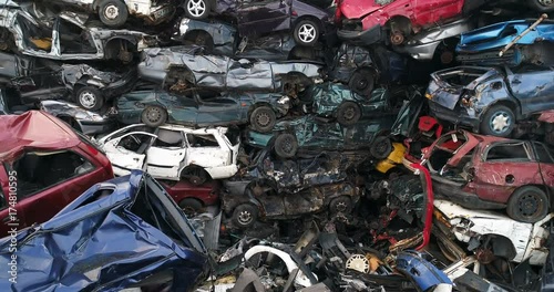 Old cars stacked in scrapyard. Car recycling