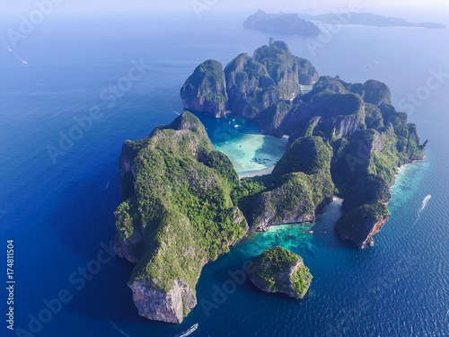 Aerial top view of isolated rocky tropical island with turquoise water and white beach. Aerial view of Phi-Phi Leh island with Maya Bay and Pileh Lagoon. Krabi province, Thailand.