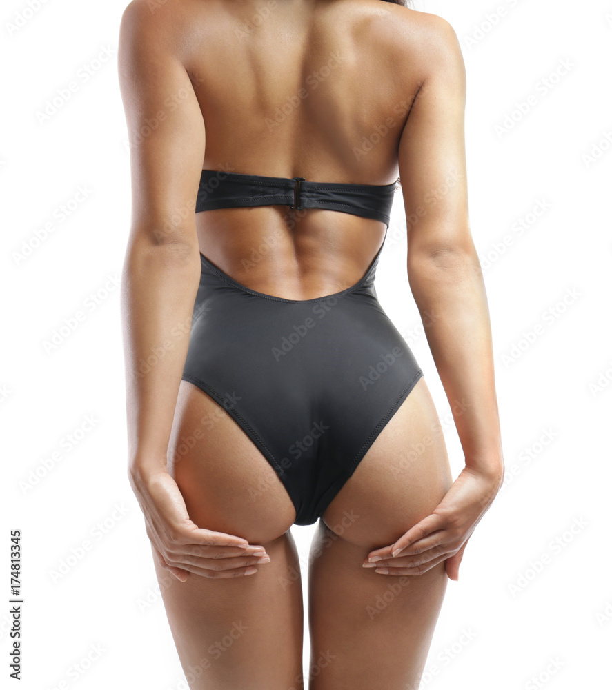 Beautiful young woman in swimming suit on white background Beautiful young woman in swimming suit on white background