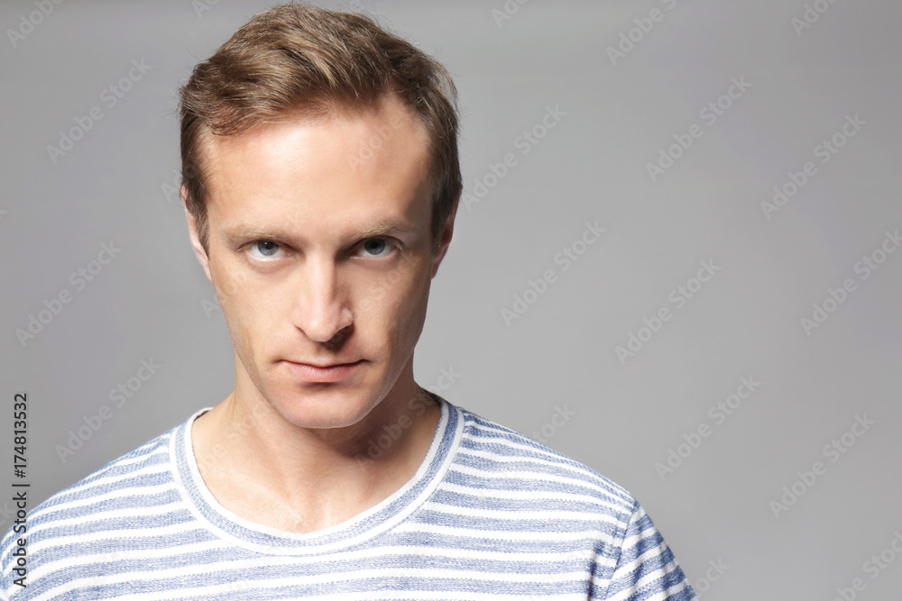 Handsome man on grey background Handsome man on grey background