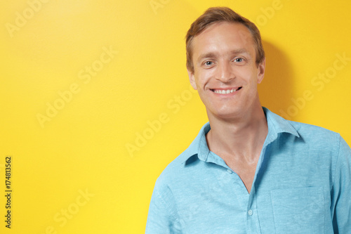 Handsome man on color background