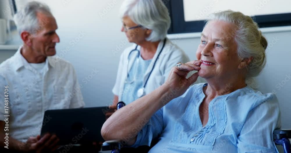 Doctor and seniors interacting with each other Doctor and seniors interacting with each other