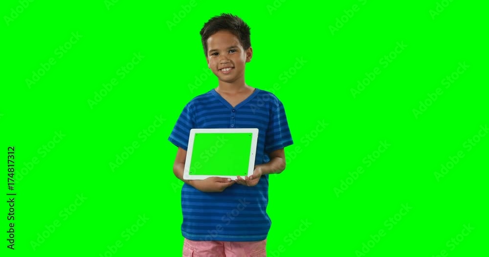 Smiling boy showing digital tablet Smiling boy showing digital tablet