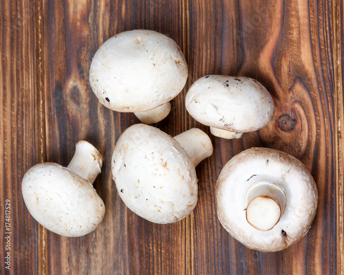 Champignon Mushrooms on Vintage Rustic Wooden Table Background