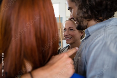 Close up of cheerful friends huddling