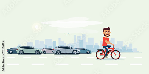 Man on Electric Bicycle on the Street with Cars behind