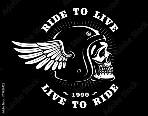 Biker skull in helmet with wing on dark background