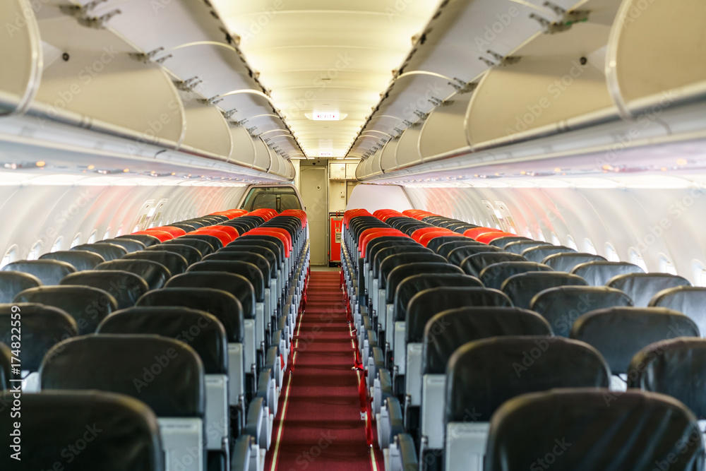 Fototapeta premium Empty passengers inside low cost airplane after plane landing
