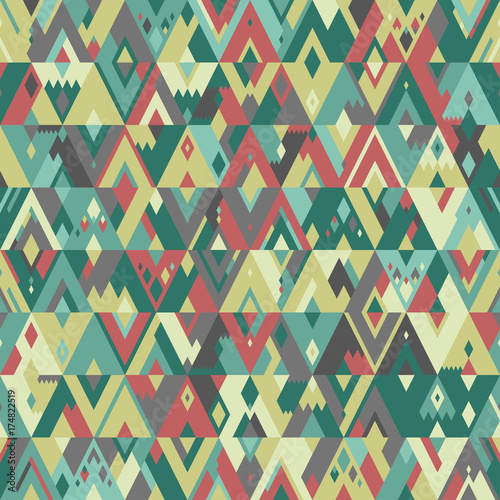 Seamless geometric vector pattern of triangles in hipster style. Pale green and red shades.