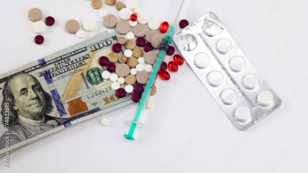 The concept of expensive treatment, pills and dollars The concept of expensive treatment, pills and dollars