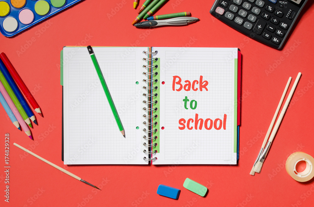 Notepad with back to school words, red background. Notepad with back to school words, red background.