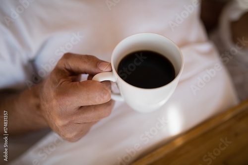 Εκτύπωση καμβά Mid section of man having black coffee